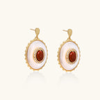 Gold-plated drop earrings with layered oval mother-of-pearl and cognac gemstone center framed by crystal halo