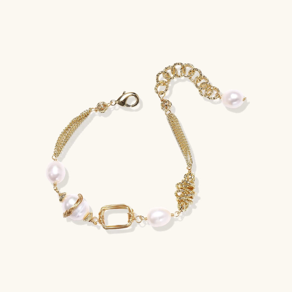 14K gold plated bracelet with freshwater pearls, filigree details, and mixed geometric elements on white background.