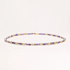 Delicate 18K gold vermeil necklace with alternating lavender zirconia beads and white freshwater pearls on cream background