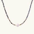 Dainty necklace with faceted purple iolite beads, gold vermeil accents, and central pink-white freshwater pearl.