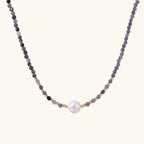 Dainty necklace with faceted purple iolite beads, gold vermeil accents, and central pink-white freshwater pearl.