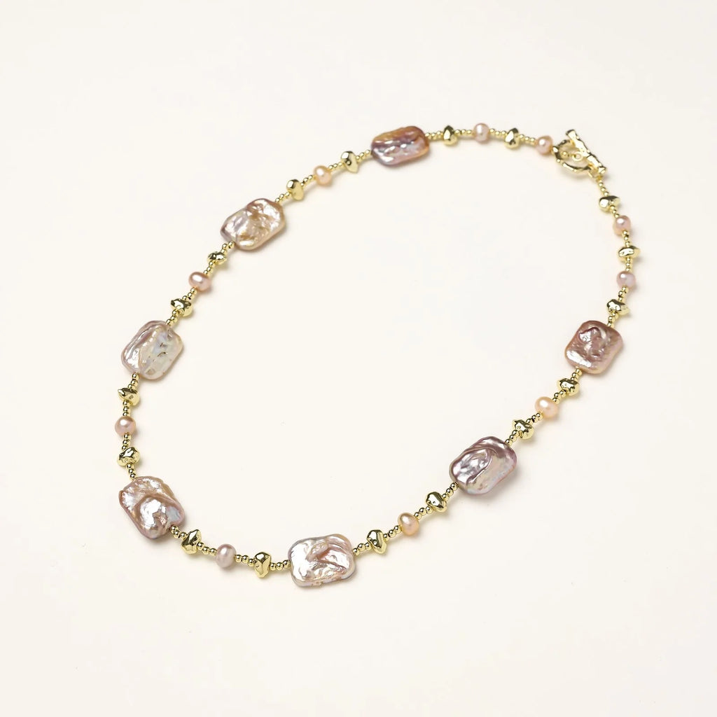 Iridescent baroque pearls alternating with small freshwater pearls on 14K gold-plated chain