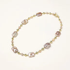 Iridescent baroque pearls alternating with small freshwater pearls on 14K gold-plated chain