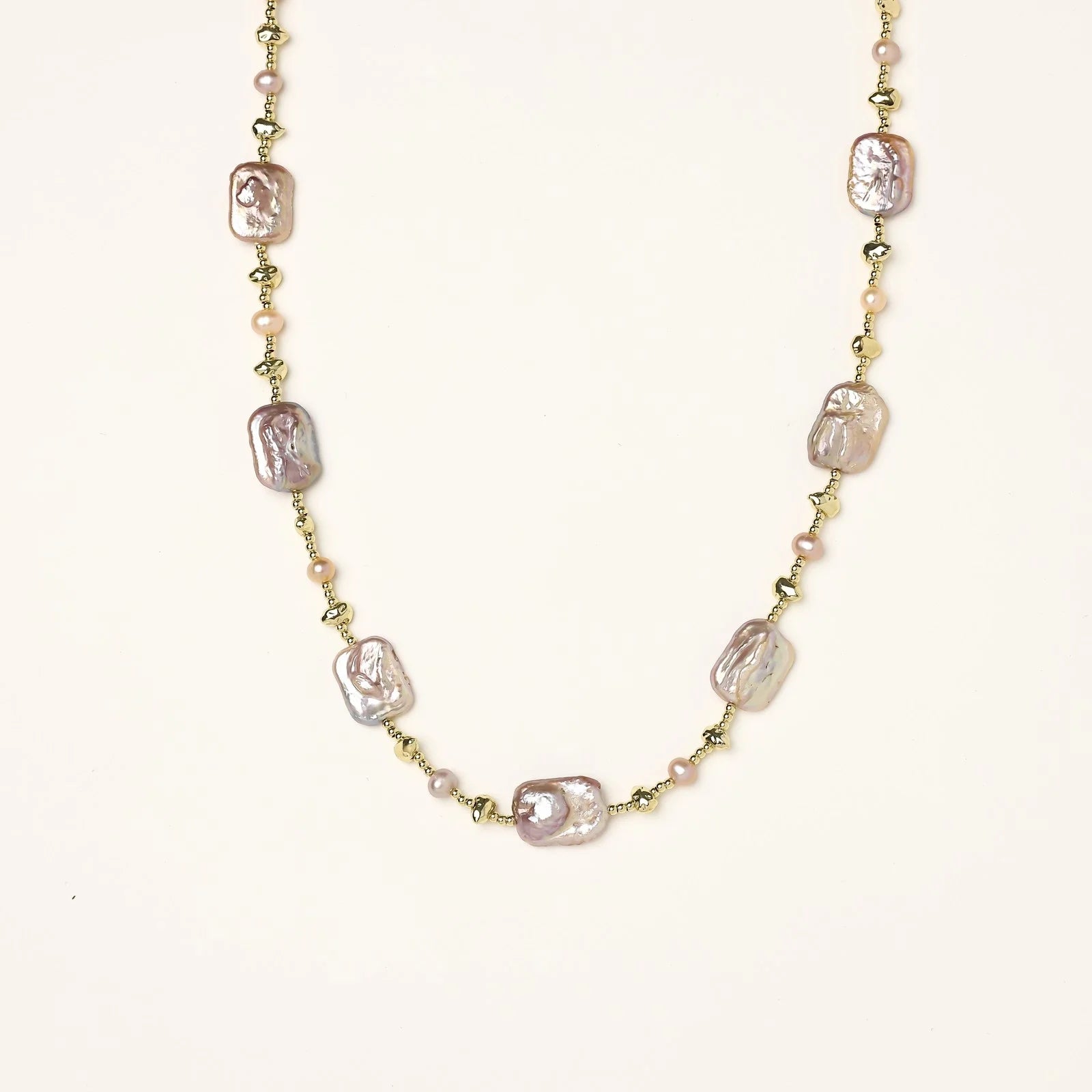 Iridescent baroque pearls alternating with small freshwater pearls on 14K gold-plated chain