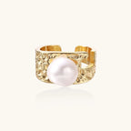 Wide gold-plated ring with organic textured band and white freshwater pearl centerpiece