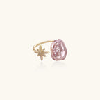 Adjustable gold ring with pink baroque freshwater pearl and crystal-studded star charm on white background