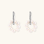 Rhodium-plated silver hoop earrings with freshwater pearls arranged in crescent formation and diamond accents