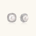 Cushion-shaped sterling silver stud earrings with freshwater pearls surrounded by geometric diamond halos