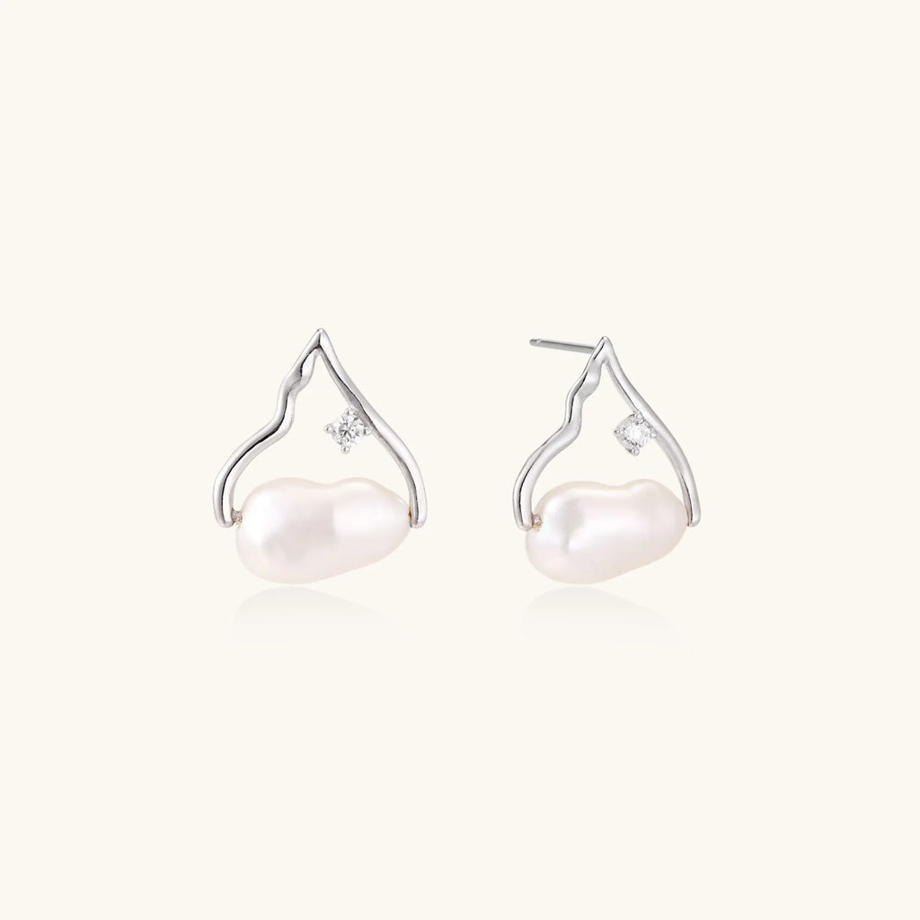 Silver mountain outline studs with baroque pearl and diamond accent on white background