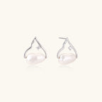 Silver mountain outline studs with baroque pearl and diamond accent on white background