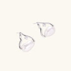 Silver mountain outline studs with baroque pearl and diamond accent on white background