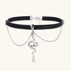 Black leather choker with white gold-plated serpent pendant adorned with zirconia crystals and teardrop charm
