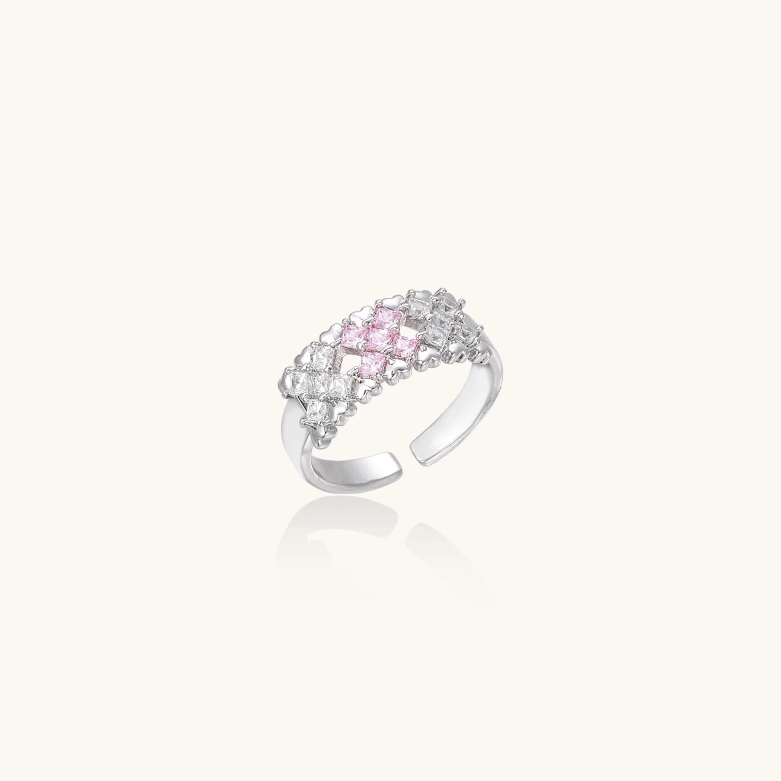 White gold plated adjustable ring with three rows of square zirconia stones in black or pink chevron pattern