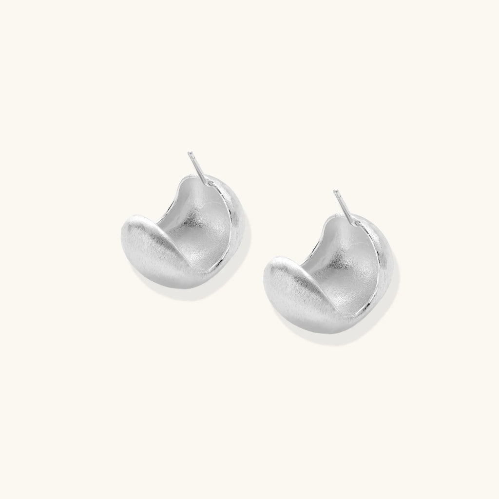 Brushed sterling silver cushion-shaped stud earrings with matte finish on white background