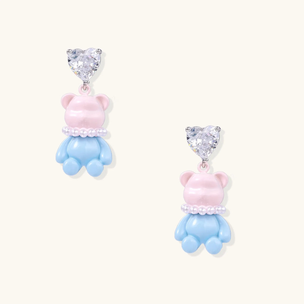 Dangle earrings with heart-cut zirconia studs and pastel teddy bear charms with pearl necklace details