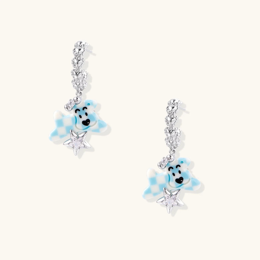 White gold plated drop earrings with crystal chain and blue checkered teddy bear charm holding star