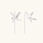 Delicate sterling silver dragonfly earrings with textured wings and curved threader hooks on white background