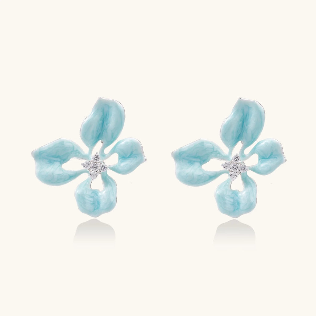 Turquoise enamel flower stud earrings with marbled finish and crystal centers on 18K gold plated brass