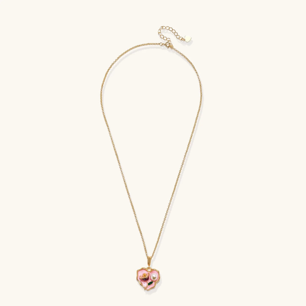 Heart-shaped pendant with pink enamel, rose design, freshwater pearl flower, and gold scalloped frame on delicate chain