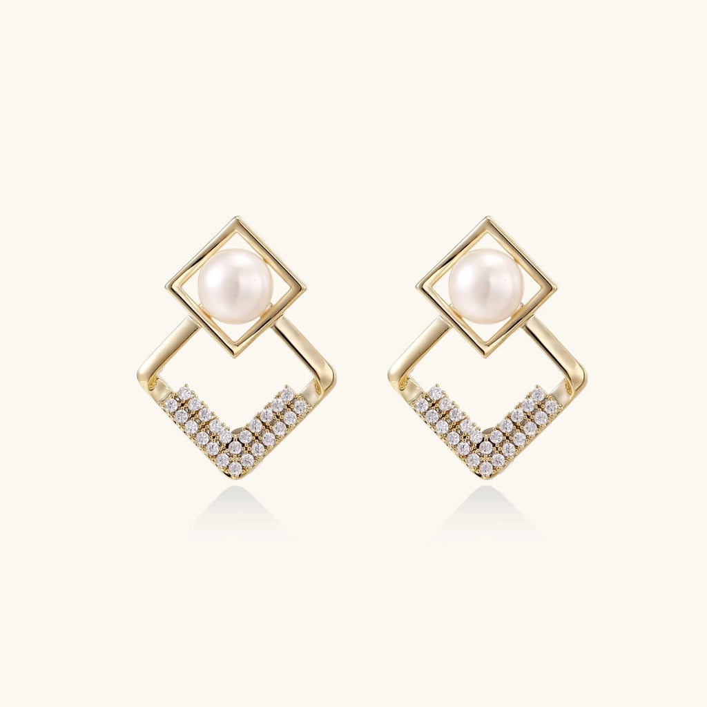 Gold-plated double square frame earrings with freshwater pearl and crystal accents on white background