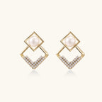 Gold-plated double square frame earrings with freshwater pearl and crystal accents on white background