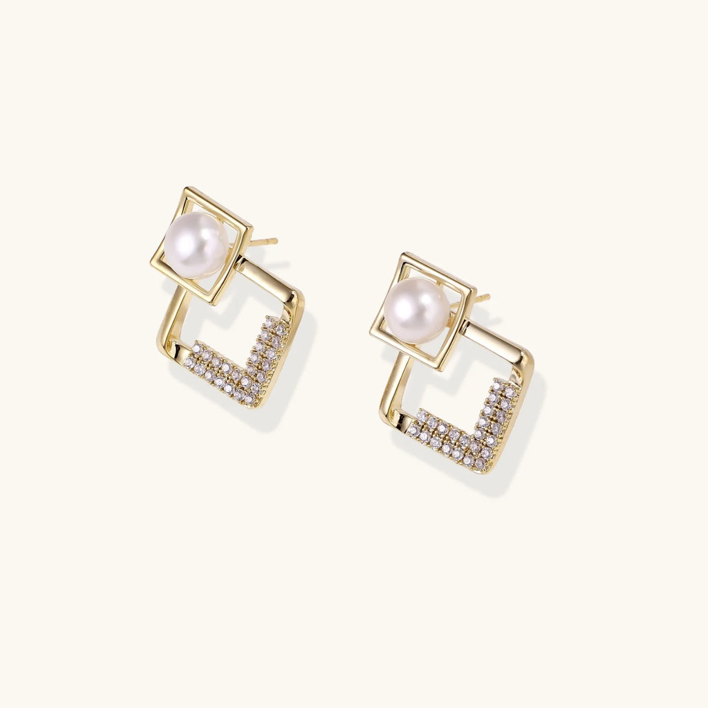Gold-plated double square frame earrings with freshwater pearl and crystal accents on white background