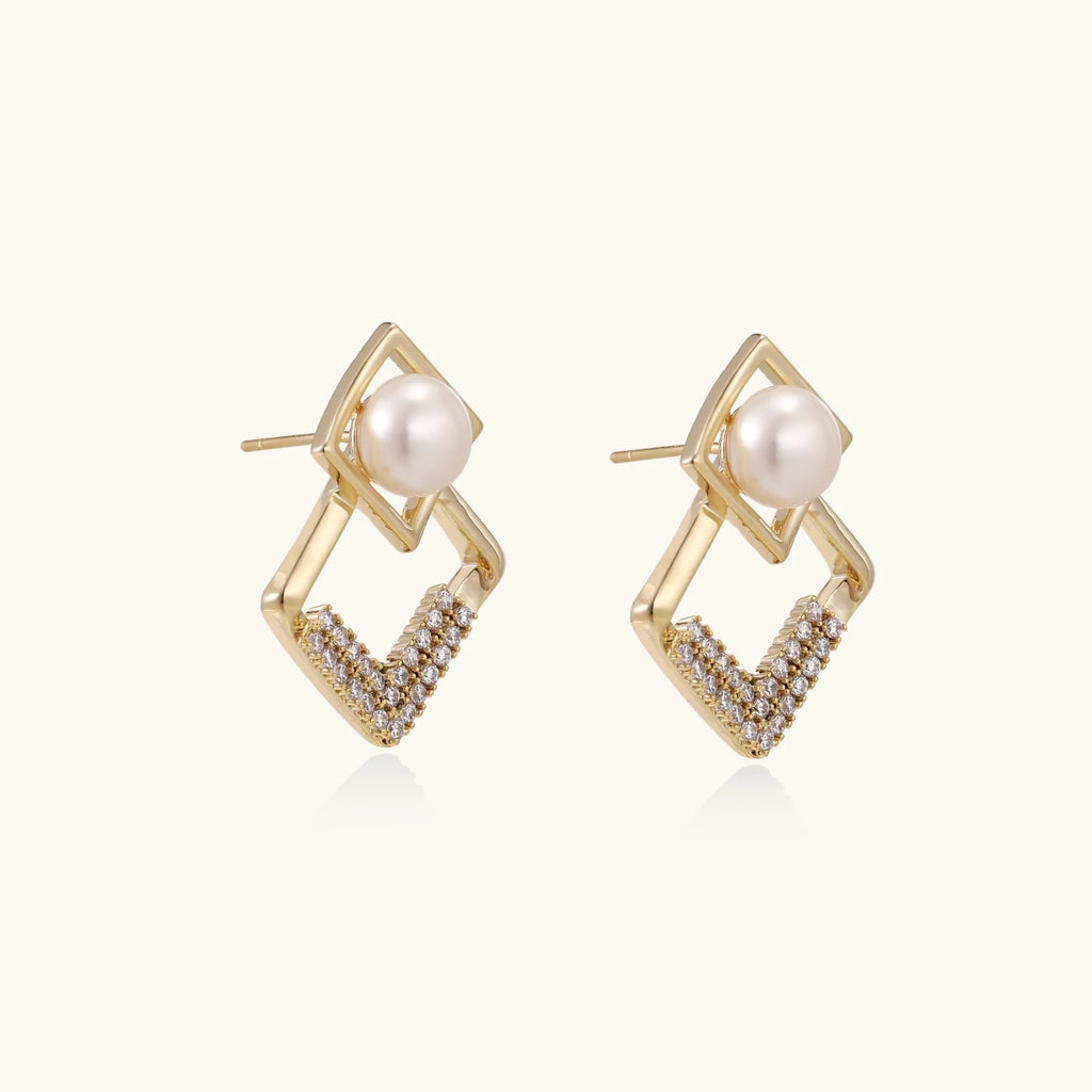 Gold-plated double square frame earrings with freshwater pearl and crystal accents on white background