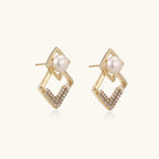 Gold-plated double square frame earrings with freshwater pearl and crystal accents on white background