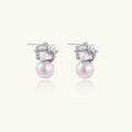 White gold stud earrings with square crystal stones in twisted frames and pink freshwater pearl drops below