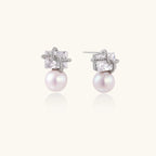 White gold stud earrings with square crystal stones in twisted frames and pink freshwater pearl drops below