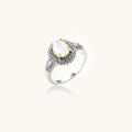 Vintage-style cocktail ring with luminous cat's eye center stone surrounded by turquoise and crystal double halo on white gold plated band
