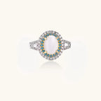 Vintage-style cocktail ring with luminous cat's eye center stone surrounded by turquoise and crystal double halo on white gold plated band