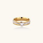 Gold-plated double-band ring with center rhinestone solitaire and channel-set stones on white background