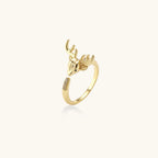 Gold-plated adjustable ring featuring 3D deer head with detailed antlers and cubic zirconia accents on cream background