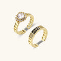 Gold-plated adjustable ring with twisted chain band, central cubic zirconia stone surrounded by crystal halo on cream background