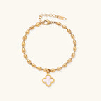 18K gold-plated oval bead chain bracelet with quatrefoil clover charm featuring mother of pearl inlay on cream background