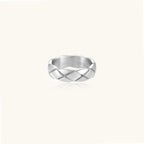 Braided stainless steel band ring with geometric interwoven strands in brushed silver finish on white background
