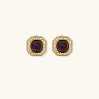 Gold-plated octagonal stud earrings with burgundy liuli centers and cubic zirconia halos on white background