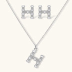 Letter H jewelry set featuring geometric crystal design in gold and white gold plated finish with adjustable chain necklace
