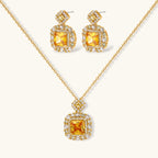 14K gold-plated jewelry set featuring square-cut cubic zirconia stones in ornate layered settings on white background.