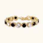 Gold-plated jewelry set with alternating black and clear cubic zirconia stones, featuring necklace, earrings and bracelet