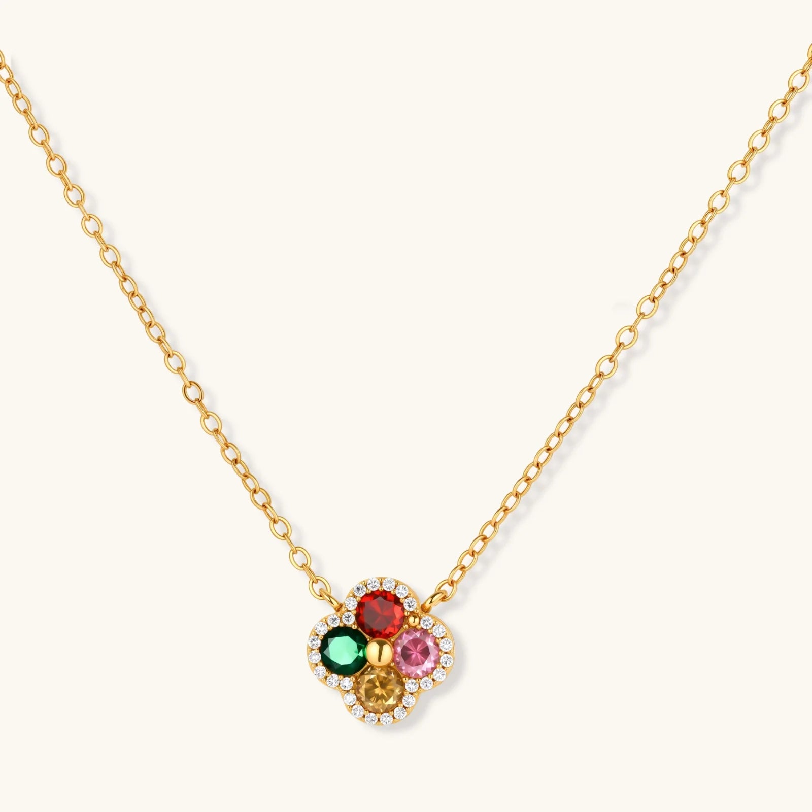 Gold-plated clover jewelry set with red, pink, green and champagne CZ stones surrounded by crystal borders