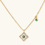 Gold-plated jewelry set with diamond-shaped pendants featuring white centers, green stones, and sparkling zirconia borders