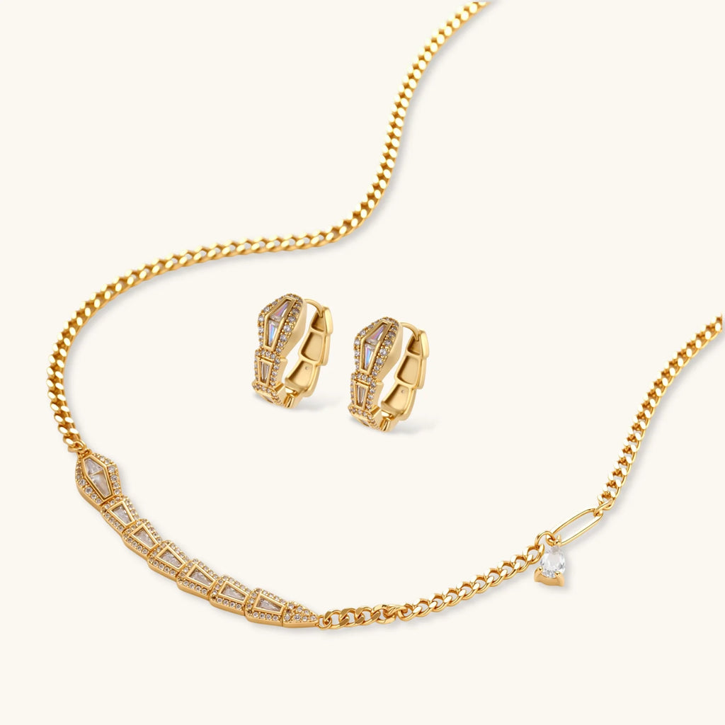 Gold-plated necklace with geometric diamond segments and matching huggie earrings featuring cubic zirconia details