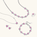 Pink heart-shaped cubic zirconia jewelry set with white gold plating featuring necklace, earrings, bracelet and ring